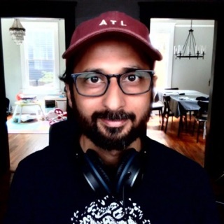 Samrit Sangal, wearing an ATL cap and glasses